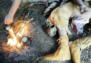 Primitive clay pots and fire.