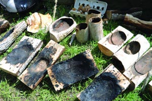 Wood Bowls made by buring hot coals.