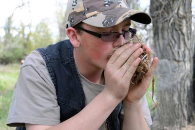 Blowing on a Tinder Bundle.