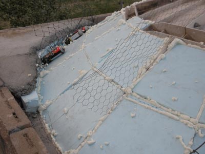 Insulating the satelite dish dome on the cinderblock castle.