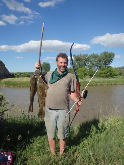 Tom with carp killed with bow and arrow.